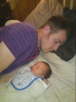 Sleepy with Daddy - 4 days old.jpg