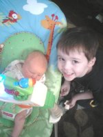 sam in bouncer with thomas 2.jpg