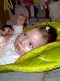 Kinley cute in green chair.jpg