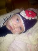 Kinley close up in purple hat 2012.jpg